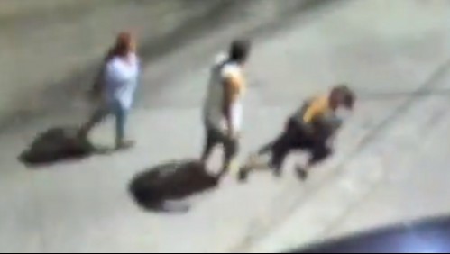 Graban a hombre dándole una golpiza a su esposa en plena calle y la policía lo captura