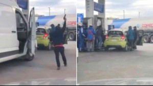 Video capta a cliente de servicentro disparando para defender a trabajadores: Los atacaron con fierros y un paraguas