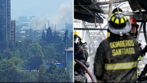 Incendio en vivienda de Estación Central amenaza con propagarse a fábrica de papeles