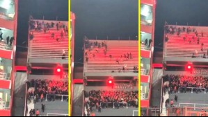 Video: Hincha de U de Chile cae desde tribuna al intentar huir de barristas de Independiente