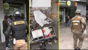 Incidentes durante retiro de toldos en Meiggs: Ambulantes se enfrentan con guardias y carabineros en plena Alameda