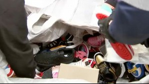 PDI allana galería en Meiggs por venta de ropa y zapatillas falsificadas: Tres detenidos y 11 locales sin patente